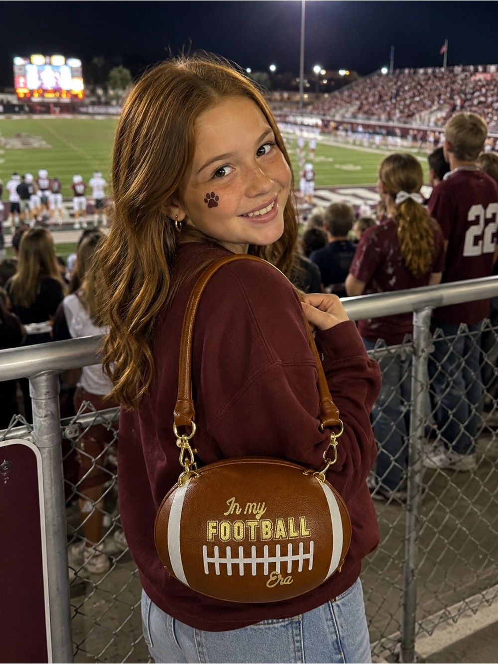 Brown 'In My Football Era' Novelty Football-Shaped Girl’s purse.
